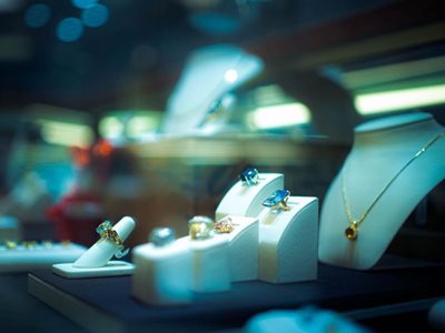 Luxury jewelry in a display case including rings, and necklaces- How MAP and Pricing Strategies are Used By Luxury Brands