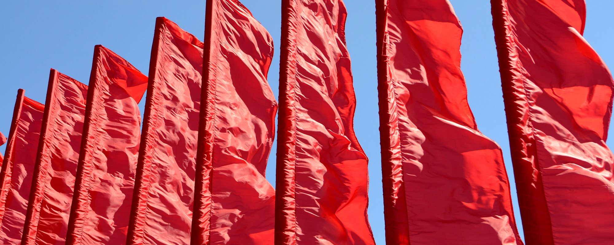 Red Flags with Sky as Background