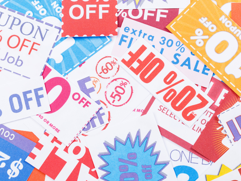 A pile of coupons showing discounts - Beyond Profits: Why Brands Need to Consider More Than Just Margins